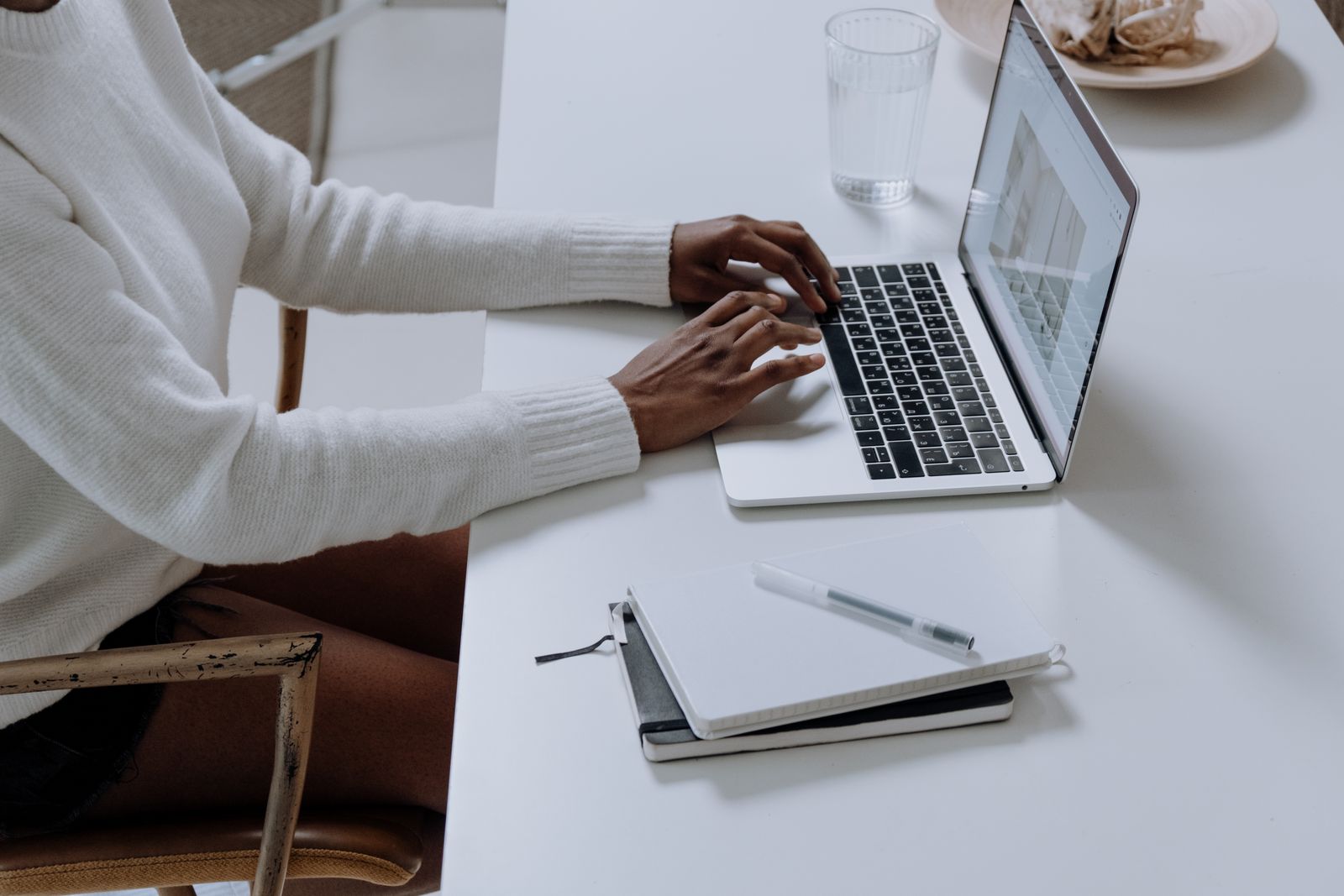 A designer working on a laptop, the workflow Squarespace optimizes for