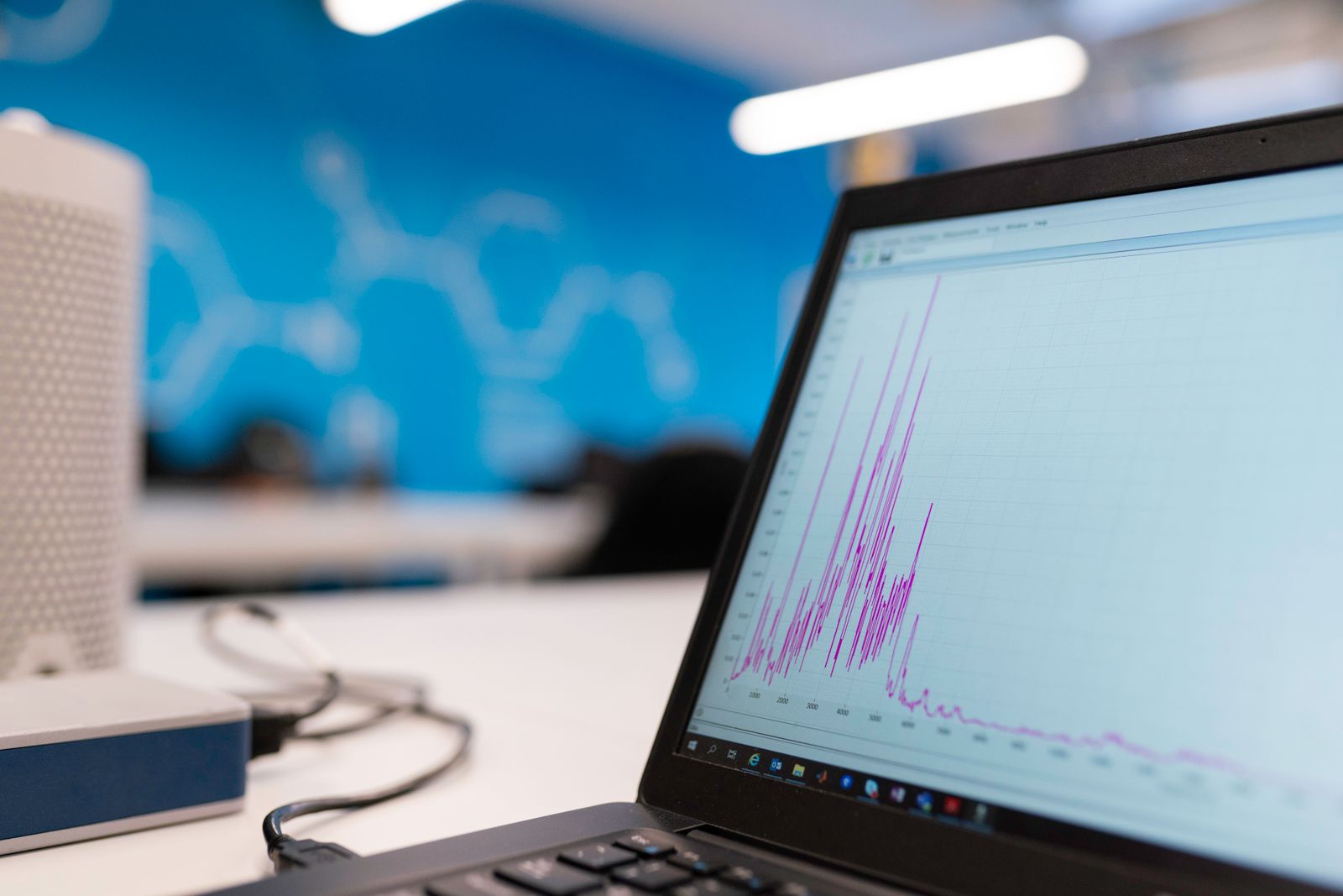 A laptop displaying a traffic graph, the metric most at risk during a website migration