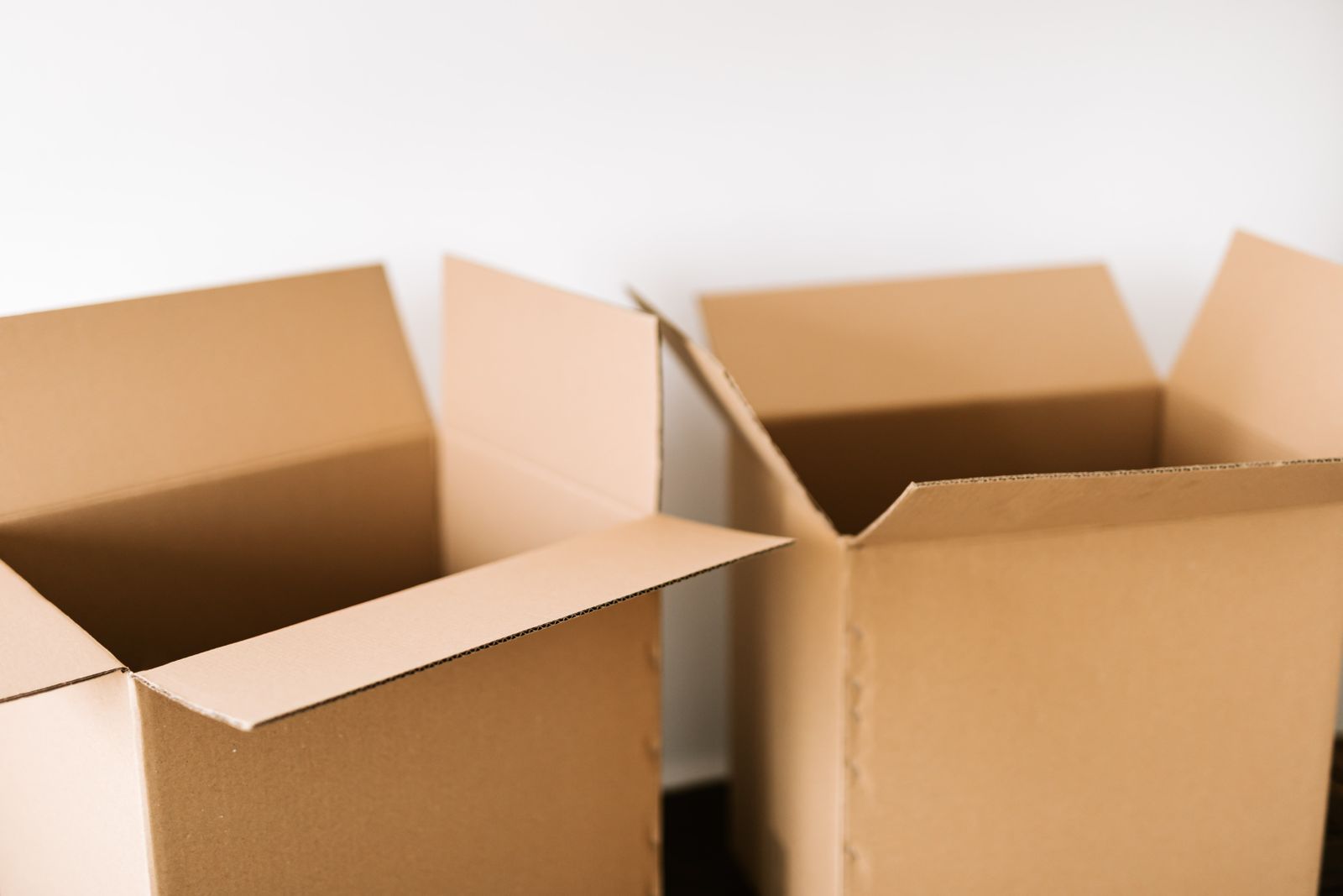 Open cardboard moving boxes ready to be packed
