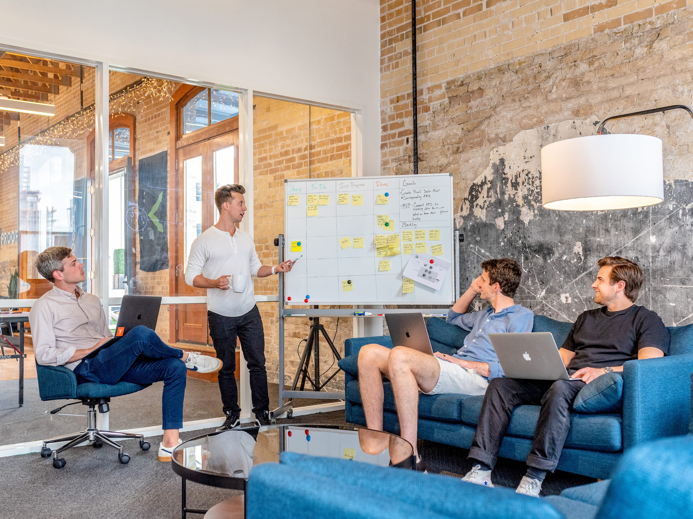 A marketing consultant leading a positioning and messaging workshop at a whiteboard