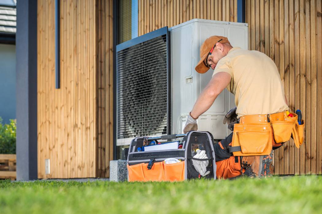 HVAC technician servicing an air conditioning system